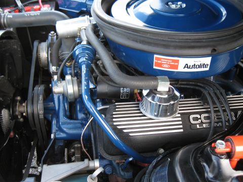 1968 Shelby GT500 - The engine bay features a blue finish, a prominent air cleaner with an Autolite sticker, and 'COBRA LE MANS' branding on the valve covers.
