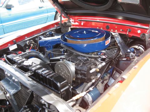 1968 Shelby GT500 - Close-up of the engine bay of a 1968 Shelby GT500, highlighting the V8 engine and its components.