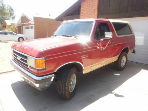 1991 Ford Bronco - This 1991 Ford Bronco is parked outside a residential garage.