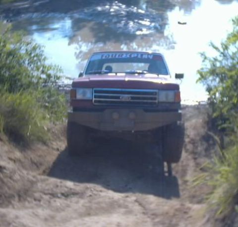 1989 Ford Bronco - This 1989 Ford Bronco navigates a muddy trail during an off-road excursion.