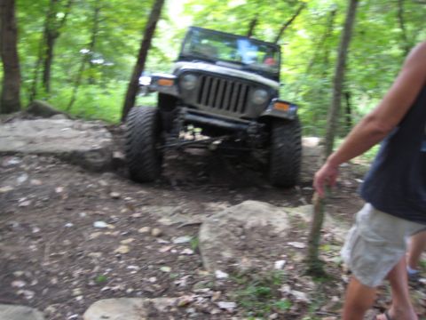 2005 Jeep Wrangler - Jeep Wrangler navigating a rocky, wooded off-road trail.
