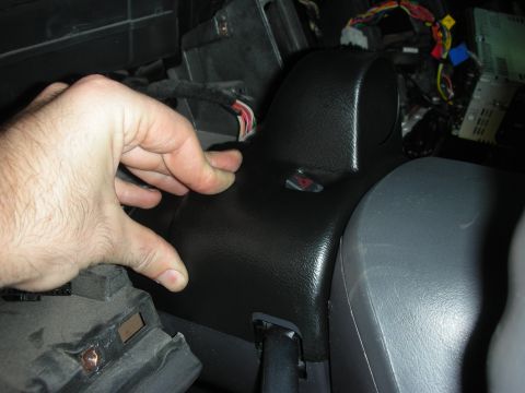 2004 Ford Crown Victoria - Close-up of vehicle interior showing dashboard trim and exposed wiring during a repair or modification.