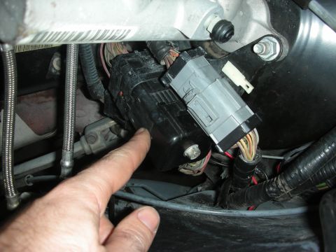 2004 Ford Crown Victoria - Close-up view of a vehicle's complex wiring harness and connectors.