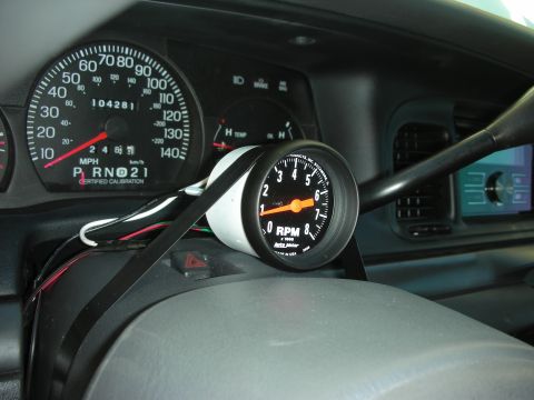 2004 Ford Crown Victoria - Aftermarket tachometer installed on the dashboard of a 2004 Ford Crown Victoria.