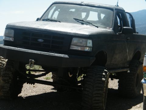 1982 Ford Bronco - This modified Ford Bronco features a lifted suspension and off-road tires, suggesting a later model year than claimed.