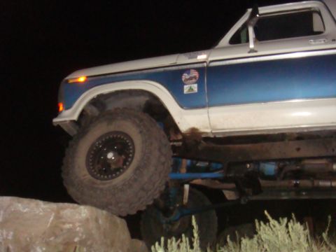 1992 Ford Bronco - This modified Ford Bronco is shown with large off-road tires, positioned on rocks.