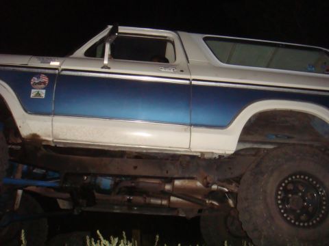 1992 Ford Bronco - This lifted Ford Bronco features a two-tone blue and white paint scheme and aftermarket wheels.