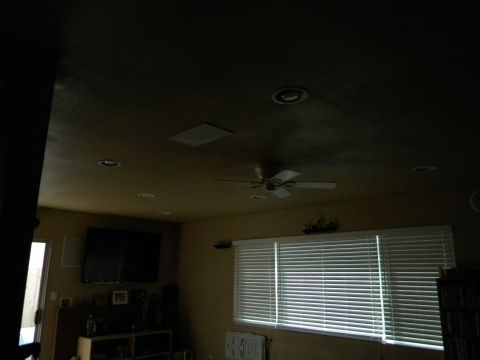 1992 Ford Bronco - A view of a room interior, a television, blinds, and a ceiling fan.