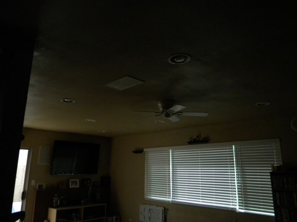 Interior room with blinds, TV, and ceiling fan