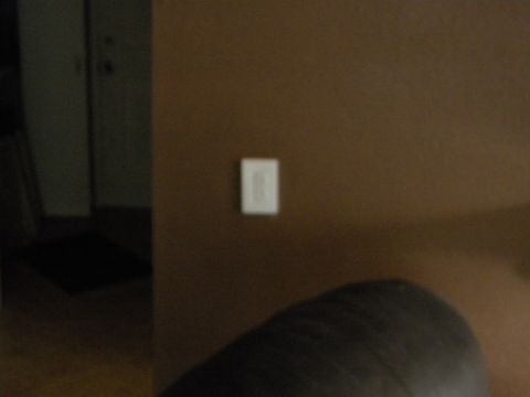 1992 Ford Bronco - A light switch is visible on a brown wall, with a watermark for Supermotors.net in the lower right corner.