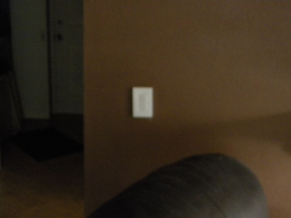 Interior wall with light switch and Supermotors.net watermark