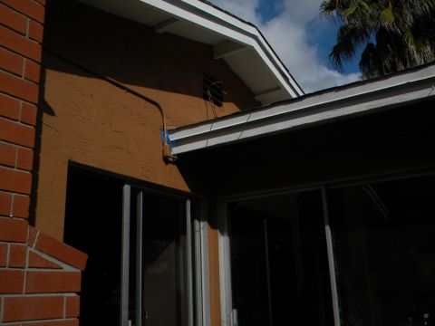 1992 Ford Bronco - A view of a house's exterior, showing architectural details and a portion of the sky.