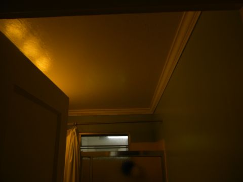 1992 Ford Bronco - A dimly lit room interior shows a doorway, a shower area with a curtain, and a website watermark.