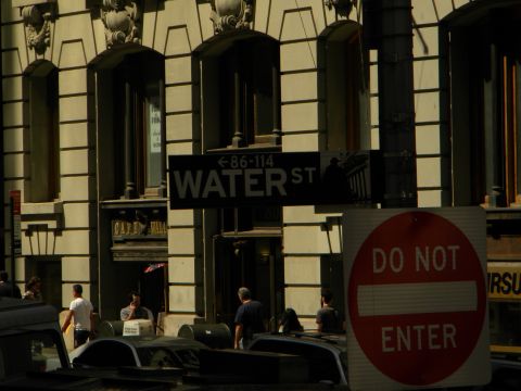 1992 Ford Bronco - A street scene in a city with a 'Water St' sign and a 'Do Not Enter' sign visible.