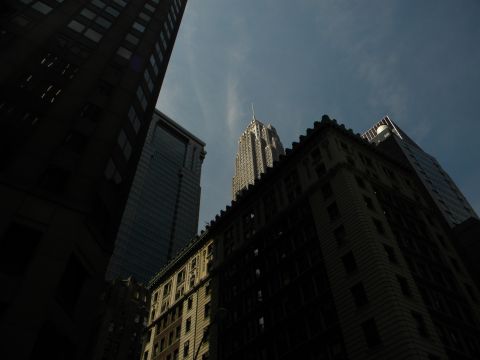 1992 Ford Bronco - A view looking up at various city buildings under a partly cloudy sky.