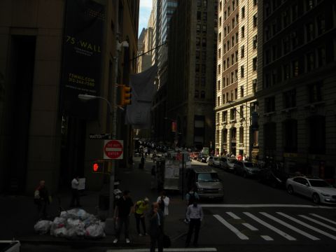 1992 Ford Bronco - A busy street scene in New York City, with buildings lining both sides and traffic on the road.