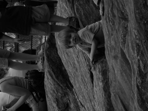 1992 Ford Bronco - Several children are seen climbing on large rock formations in this black and white photograph.
