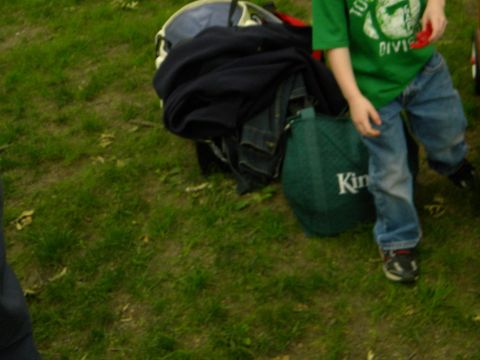 1992 Ford Bronco - A child stands near a pile of luggage on a grassy area.