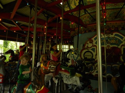 1992 Ford Bronco - A carousel scene with children enjoying rides on painted horses.
