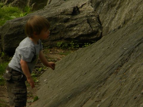 1992 Ford Bronco - Young child explores a rocky outdoor environment.