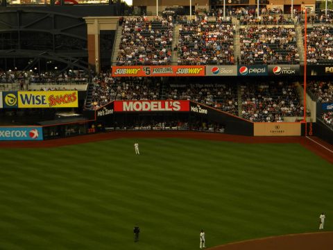 1992 Ford Bronco - A baseball game is in progress at a stadium filled with fans.