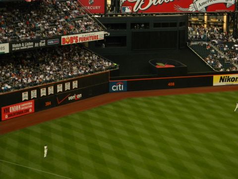 1992 Ford Bronco - A view of a baseball stadium during a game, showing the field, stands, and various advertisements.