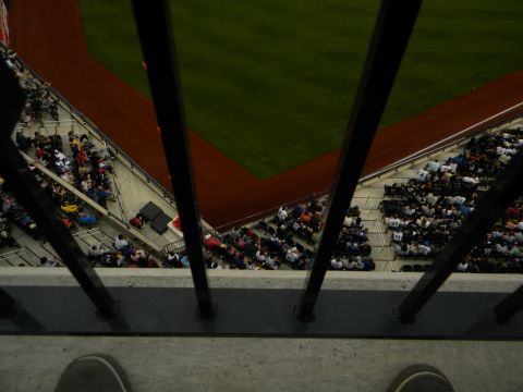 1992 Ford Bronco - A baseball game is underway with fans in the stands and the field visible from an elevated perspective.