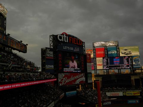 1992 Ford Bronco - View of Citi Field stadium's large scoreboards and advertisements on a cloudy day.
