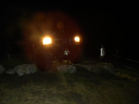1992 Ford Bronco - 1992 Ford Bronco seen at night with its headlights illuminated.