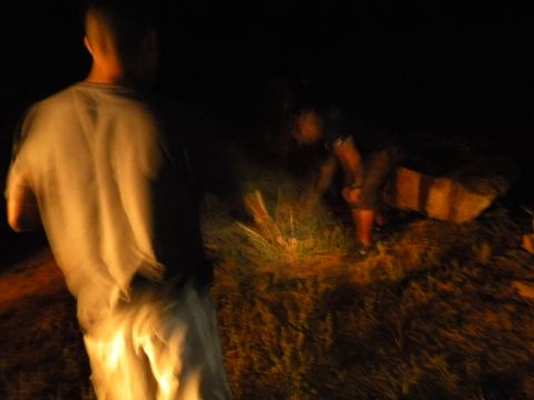 1992 Ford Bronco - Several individuals are visible in a dimly lit outdoor scene at night.