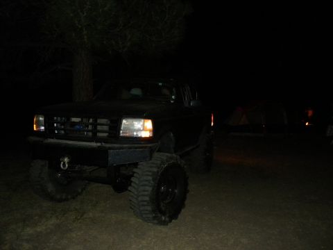 1992 Ford Bronco - This 1992 Ford Bronco is shown at night with its distinctive grille and oversized tires.