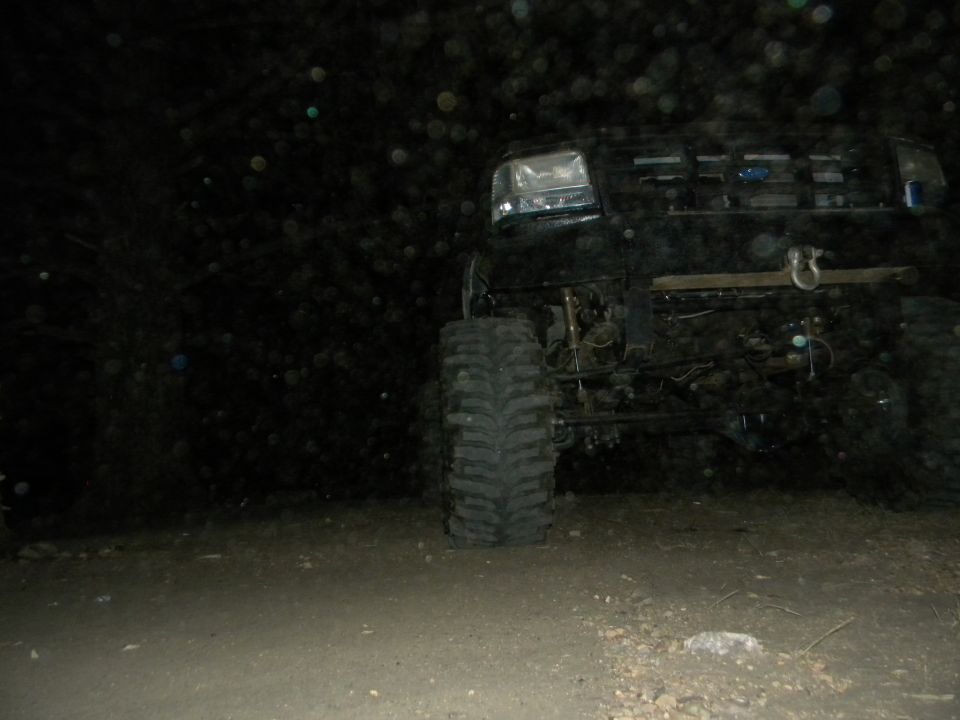 1992 Ford Bronco front quarter view at night, showing large tires and winch