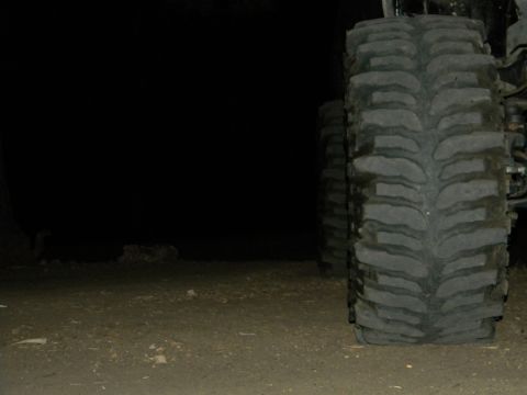 1992 Ford Bronco - A close-up view of a large tire tread, with another tire visible in the background.