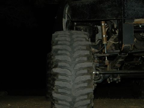 1992 Ford Bronco - This image focuses on the heavy-duty tire and suspension of an off-road vehicle, with no clear year identification visible.