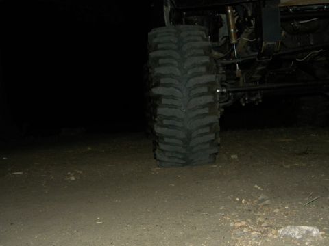 1992 Ford Bronco - Off-road tire and suspension details are visible in this nighttime shot.