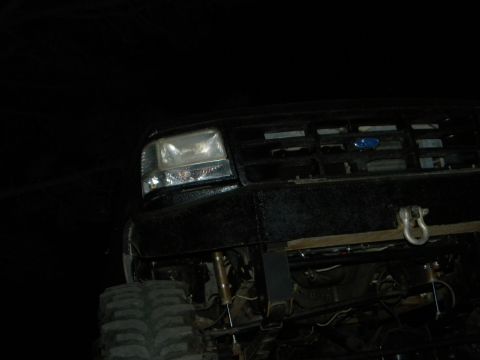 1992 Ford Bronco - This Ford truck features a prominent grille and a heavy-duty bumper, suggesting it's built for off-road use.