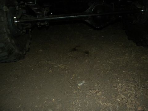 1992 Ford Bronco - Close-up view of a vehicle's rear axle and tire.