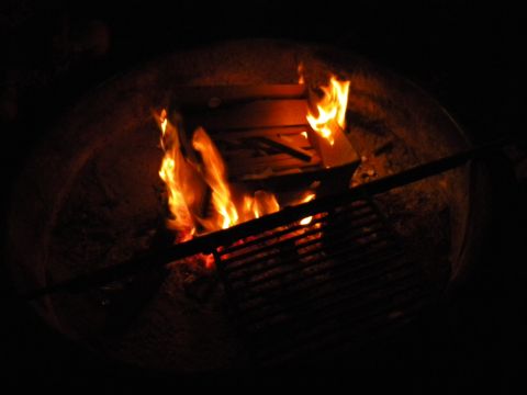 1992 Ford Bronco - Flames flicker within a dark fireplace, casting a warm glow.