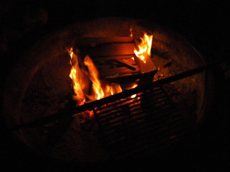 Fire burning in a dark fireplace