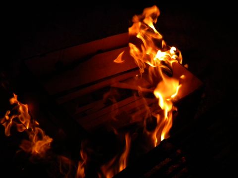 1992 Ford Bronco - A dramatic scene of intense fire burning in the darkness.