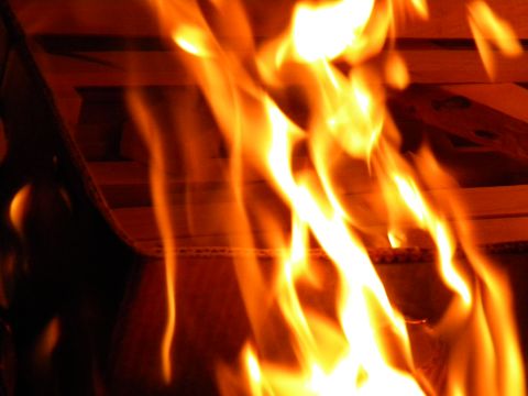 1992 Ford Bronco - Close-up of bright orange and yellow flames from a fire.