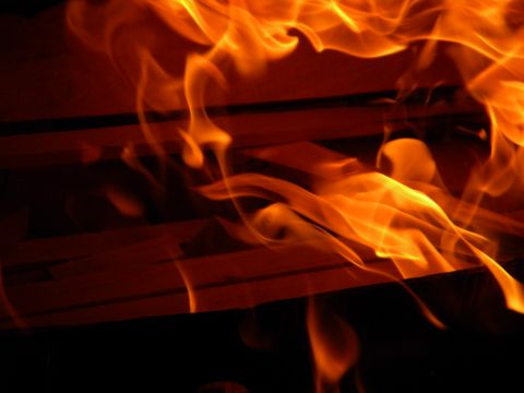 1992 Ford Bronco - A close-up view of a fire, with bright orange and yellow flames consuming the subject.