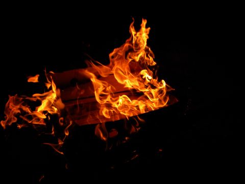 1992 Ford Bronco - A close-up view of intense flames burning brightly in the dark.