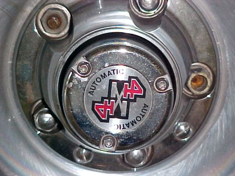 1996 Ford Bronco - Automatic locking hub with 4x4 emblem.