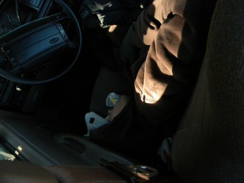 1992 Ford Bronco - Interior view of a 1992 Ford Bronco, highlighting the steering wheel and a person in the passenger seat.