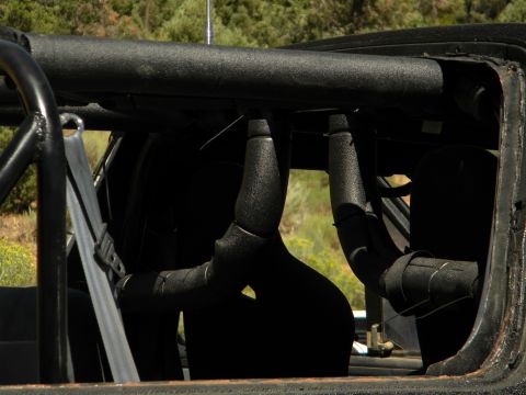 1992 Ford Bronco - Interior view of a 1992 Ford Bronco, showing the roll cage and seats.