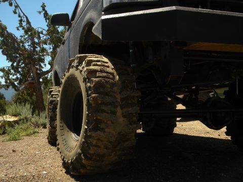 1992 Ford Bronco - This heavily modified SUV features oversized tires and a suspension, ready for off-road adventures.