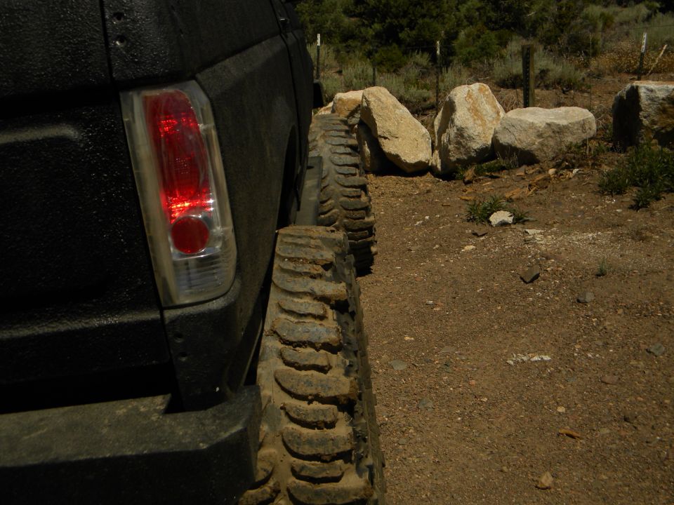 Black 1992 Ford Bronco rear quarter panel with large off-road tires