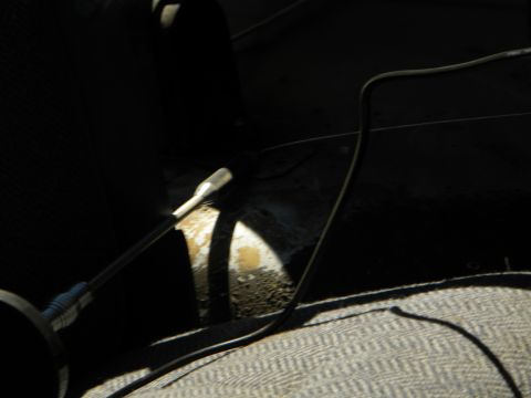 1992 Ford Bronco - Interior view of a vehicle with a lever and wires visible on the seat.