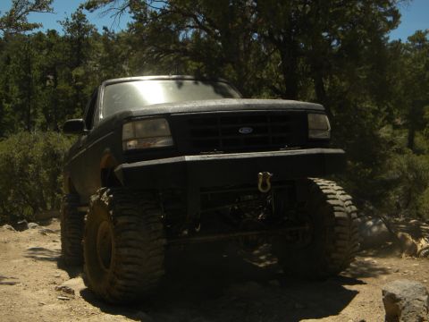 1992 Ford Bronco - This modified 1992 Ford Bronco is shown off-road with its substantial tires and custom front bumper.